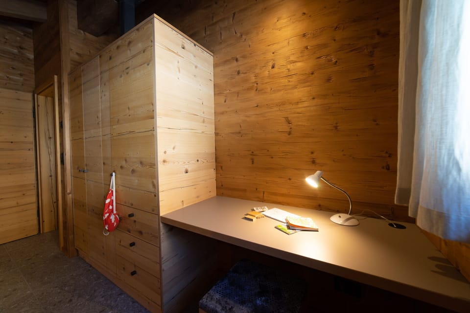 Workspace with desk and wooden interior in the chalet