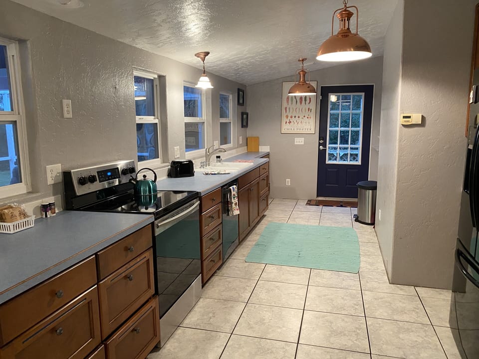 Kitchen opens to Deck w/BBQ. Cook with views of Creek & protected marshland