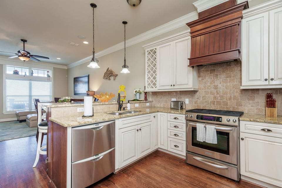 Your gourmet kitchen awaits with granite counters, stainless appliances, and charming details that make cooking a joy.
