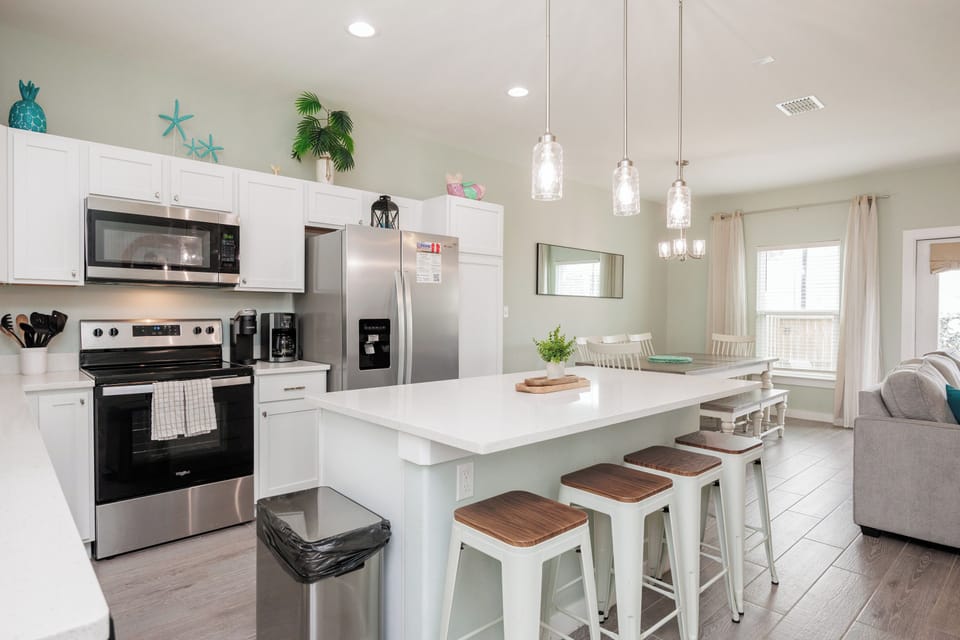 Your open-concept kitchen flows seamlessly into the dining area, perfect for gathering with loved ones over home-cooked meals.