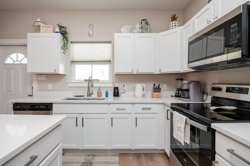 Cook your favorite meals in this bright, fully-equipped kitchen with modern appliances and plenty of counter space for your culinary adventures.