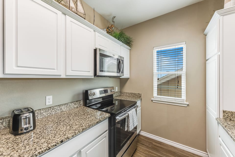 Modern kitchen on third floor with stainless steel appliances