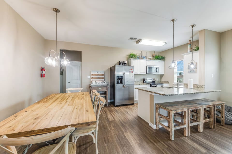 Breakfast bar and well-equipped kitchen to gather for game night or meals