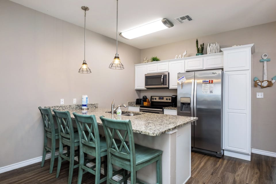 Breakfast bar with seating for four to enjoy family gatherings while cooking meals together