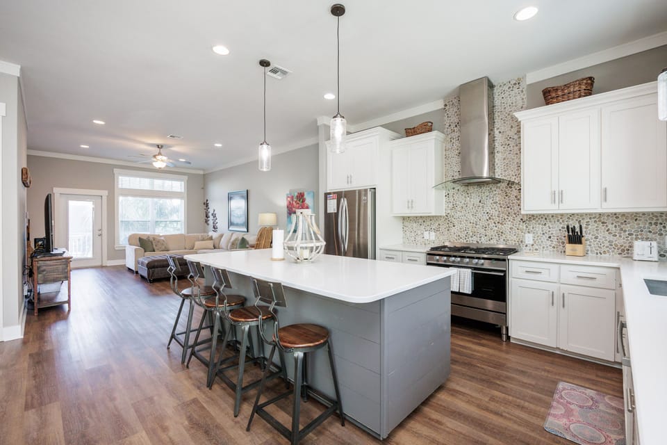 You'll love cooking in this bright, modern kitchen with its spacious island, perfect for morning coffee or sharing meals together.