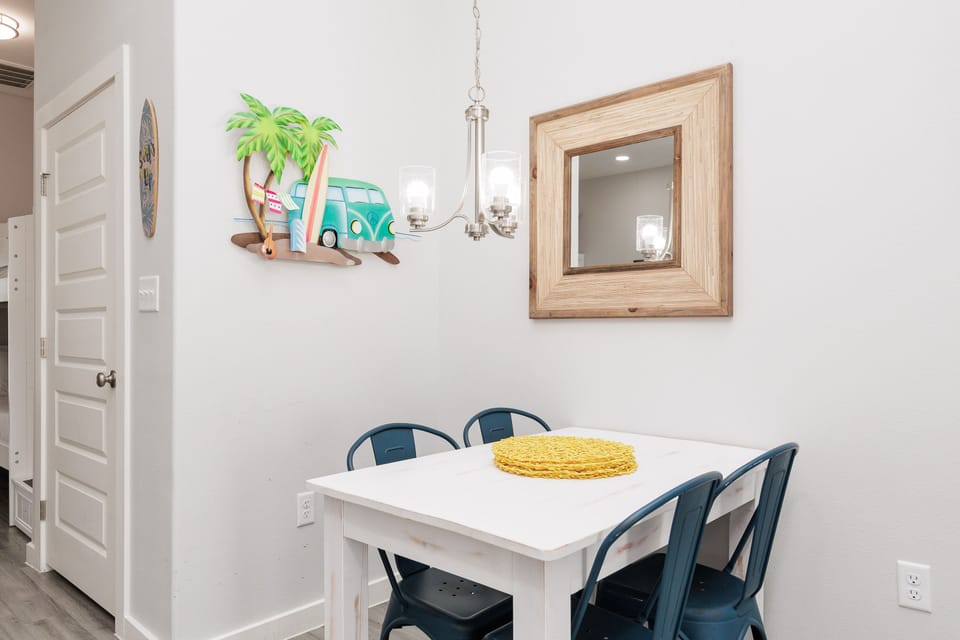 Your cozy dining space features charming beach-themed décor and comfortable seating for memorable meals together.