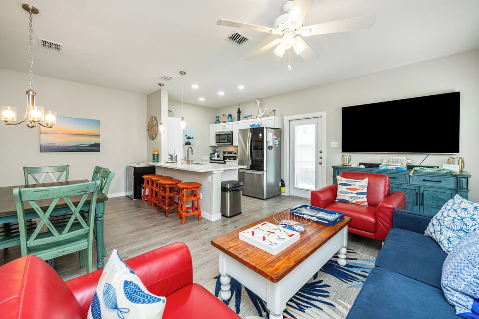 Step into your vibrant coastal retreat where bold blues and cheerful oranges create a welcoming atmosphere for memorable vacation moments.