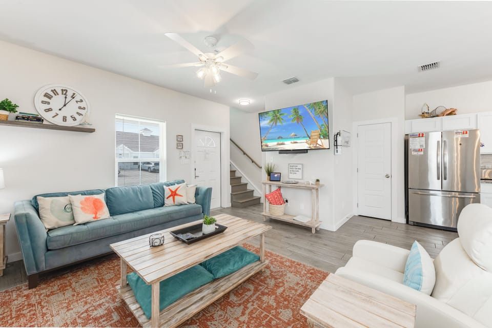 Sink into coastal comfort in this bright living space where ocean breezes meet modern style and your tropical getaway begins.