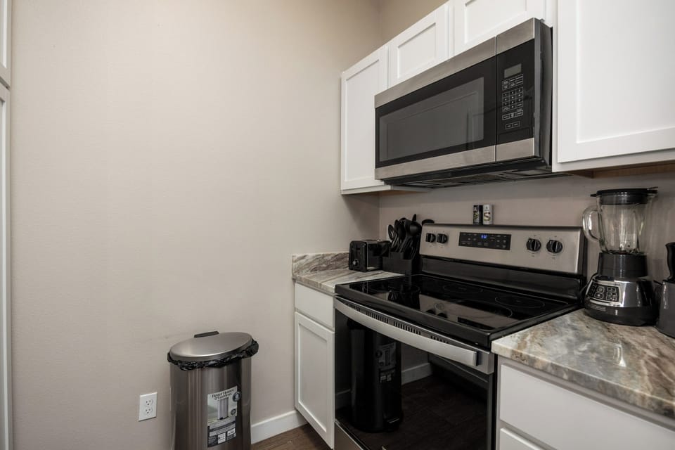 Your fully equipped kitchen awaits with stainless steel appliances, granite countertops, and everything you need to create delicious home-cooked meals during your stay.