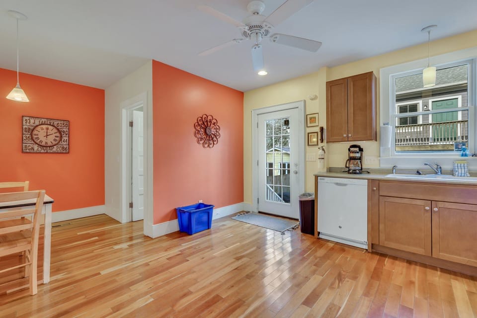 Located off of the kitchen, guests will find a shared courtyard, full bathroom and an additional breakfast table.