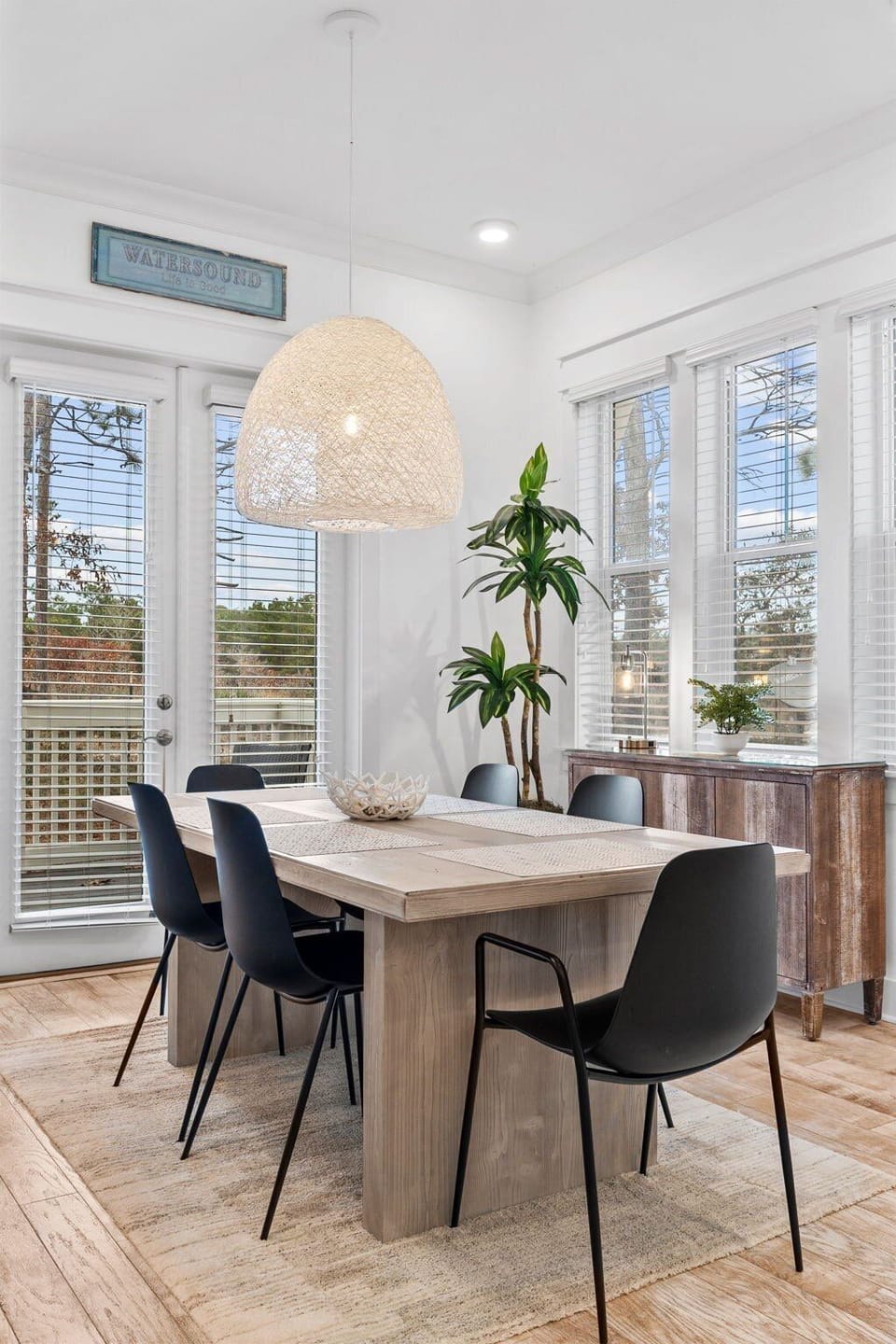 Start your mornings in this charming dining nook with bright natural light and access to a private patio.