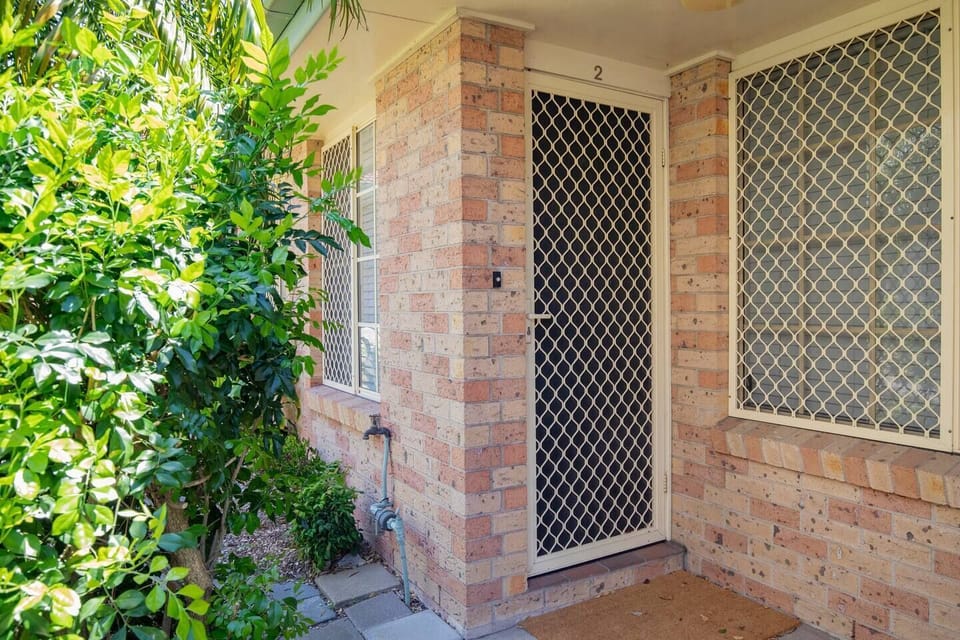 Nestled in the lively community of Tighes Hill, this townhouse blends a convenient location with roomy interiors, thoughtfully designed for couples or solo travellers.