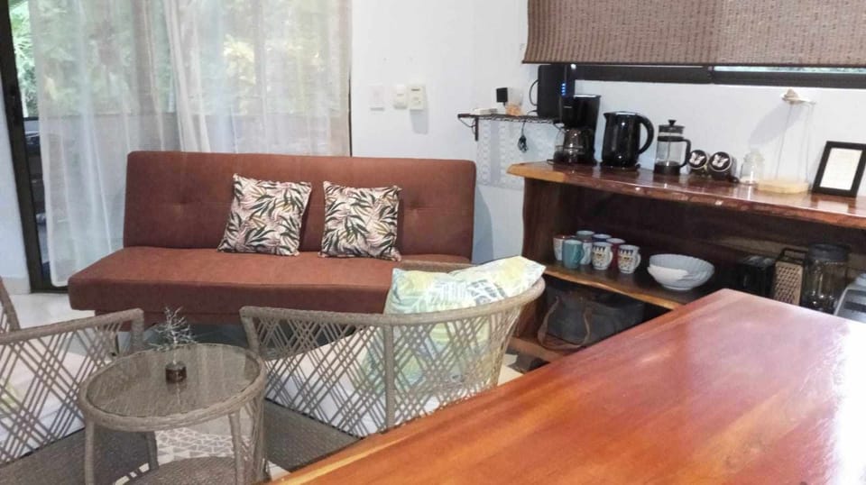 The comfortable living space is a great place to enjoy a drink after a long day.