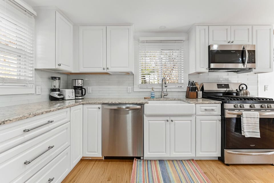 Kitchen area with complete kitchen essentials.