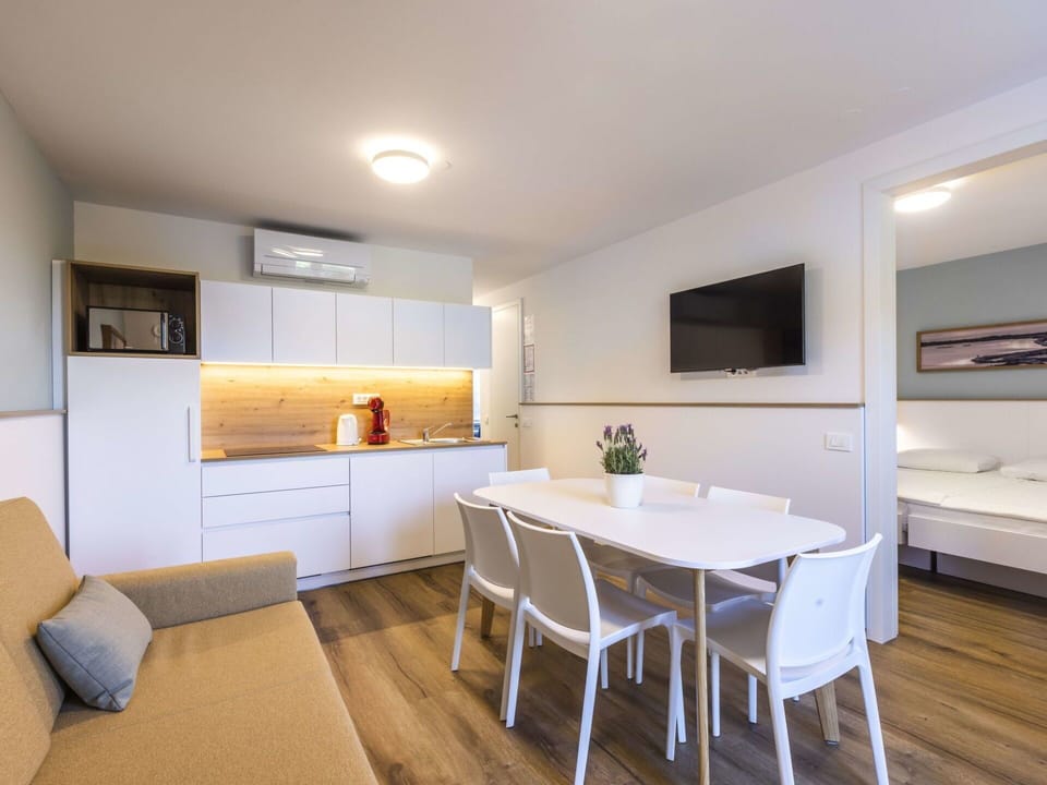 Table, Furniture, Property, Countertop, Cabinetry, Couch, Interior Design, Wood, Flooring, Living Room