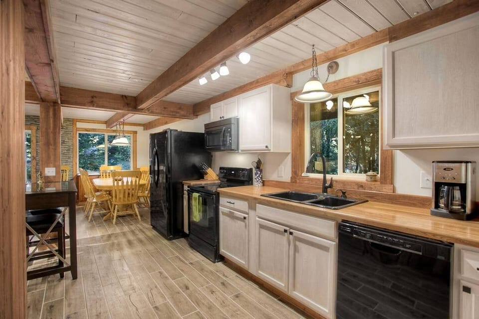 Wood beams, flooring and accents for authentic cabin environment right as you step in