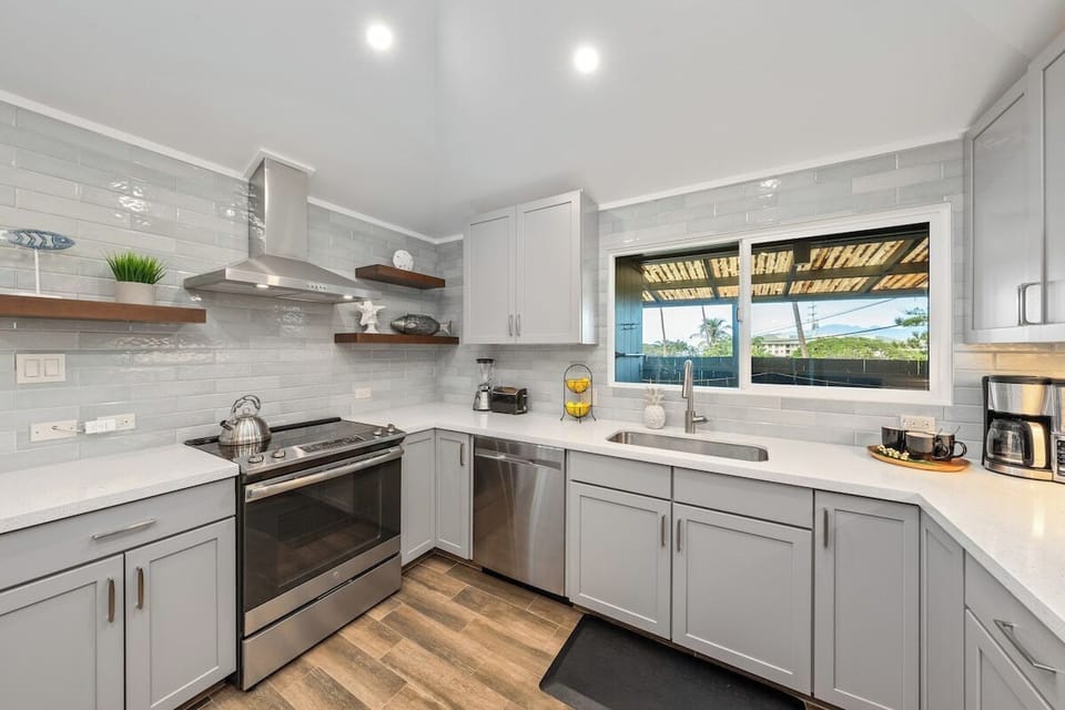 Enjoy cooking in a bright, airy space with elegant lighting and thoughtful design
