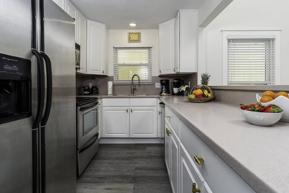 Kitchen with Stainless Steel Appliances ~ Refrigerator, Electric Oven & Cooktop, Dishwasher & Microwave