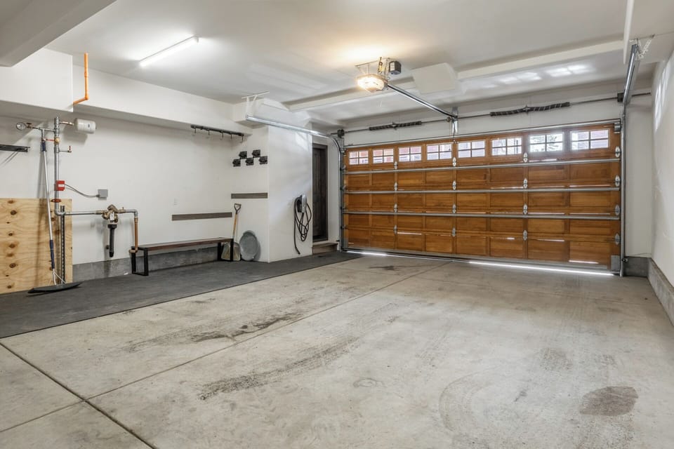 The oversized two-car garage is built for mountain life, with plenty of space for vehicles, gear, and easy coming and going throughout your stay.