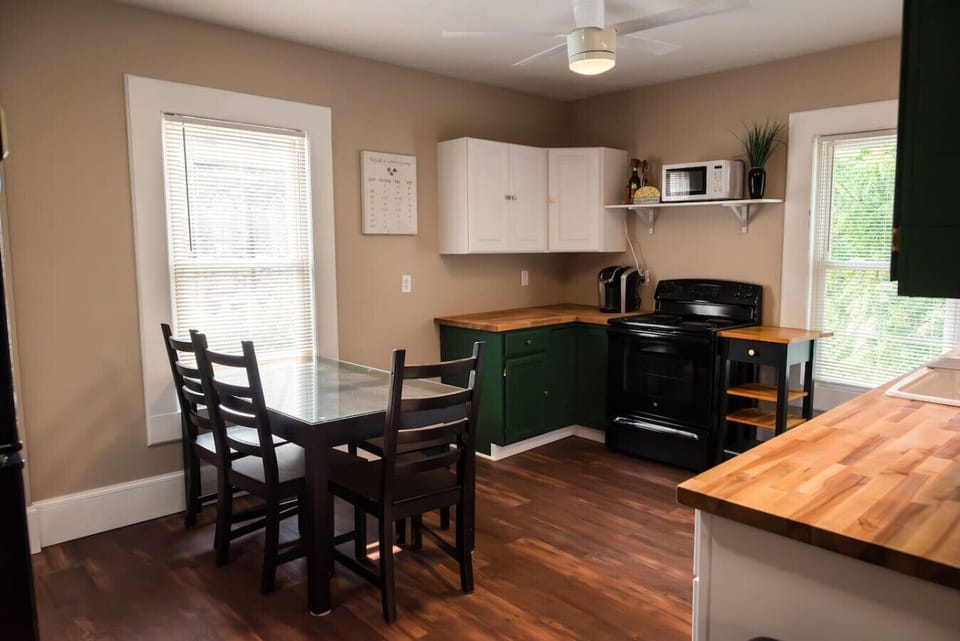 The table is set up to seat 5 people, but can be expanded to include an additional 3-4.