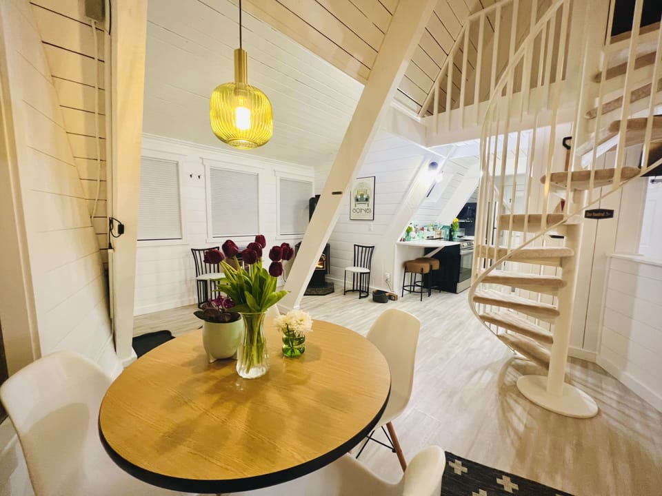 Living and Kitchen Spaces with Stairs leading to the loft bedroom