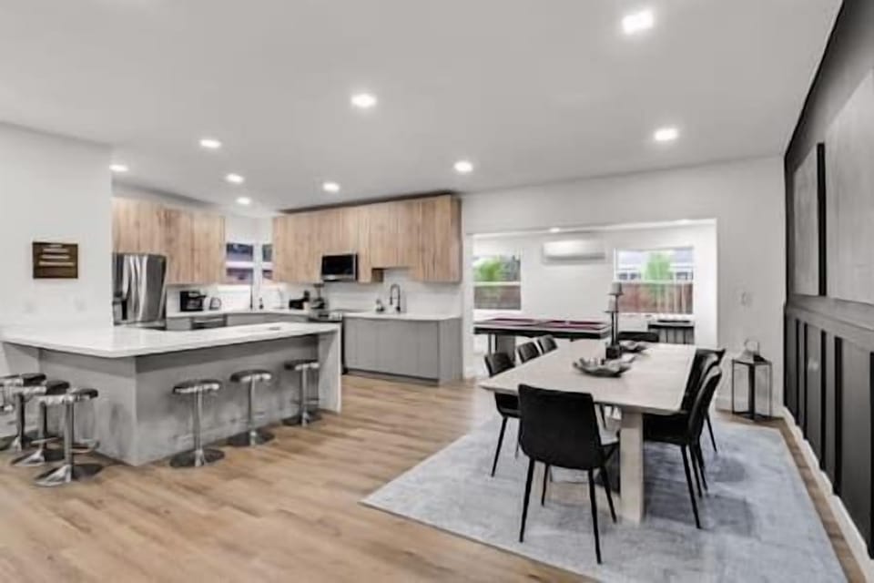 Kitchen and dining area with additional seating.