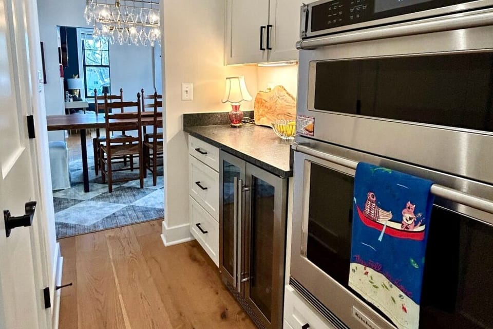 The butlers pantry features a beverage refrigerator, microwave, and second oven.