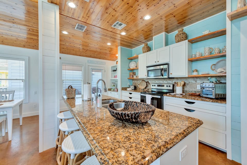 The large island doubles as a breakfast bar for the kids.