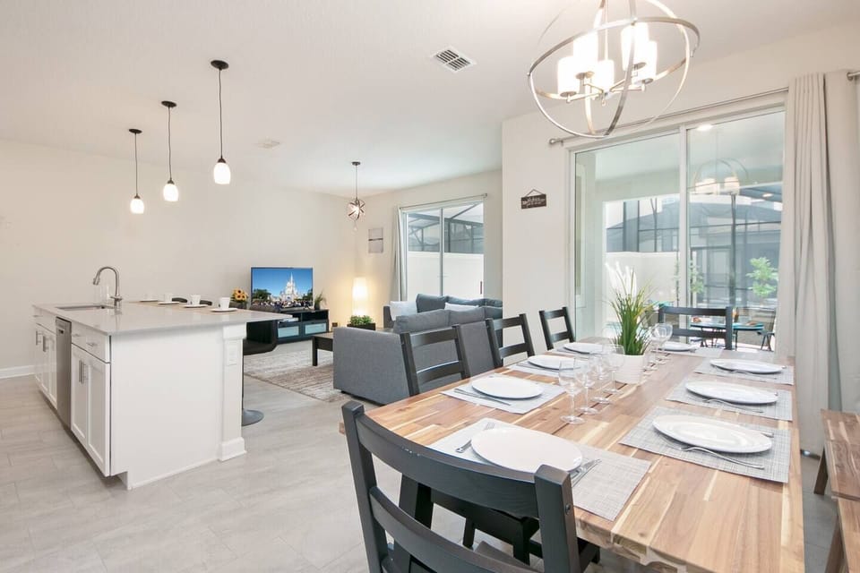The open floorplan design integrates the kitchen with the living and dining areas.