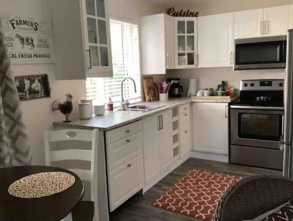 Kitchen with full size stain steel appliances.
