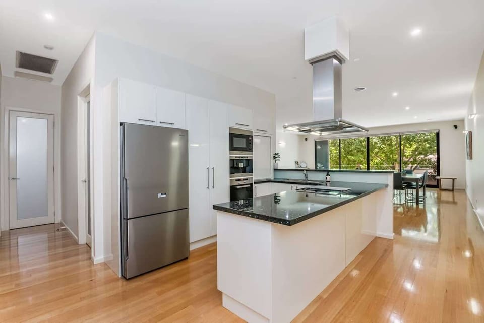 Fully equipped kitchen with Miele appliances.