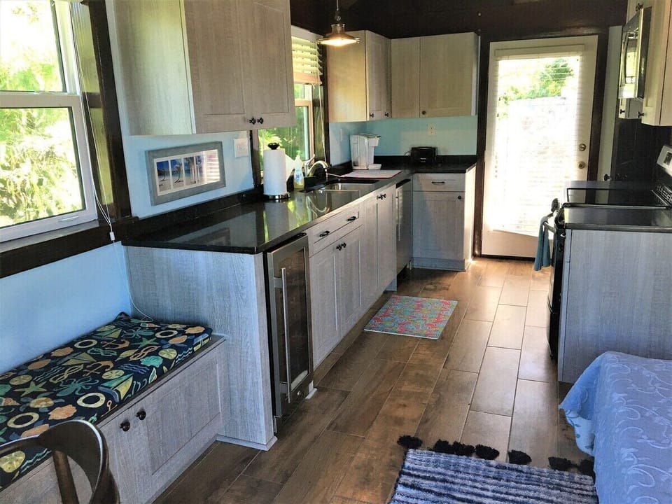 Upper Guest House Kitchenette with Fridge, Range, microwave and beverage fridge.