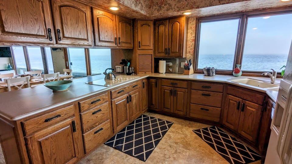 Very well stocked kitchen with expansive water views