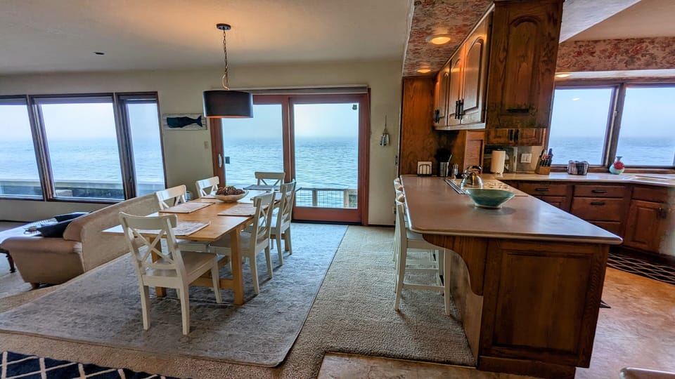 Dining area with sliding doors to the waterside patio