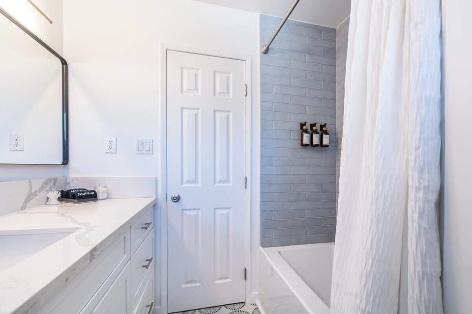 Bathroom 2: Clean and well-maintained full bathroom with fresh towels and essential toiletries, providing a refreshing space to start and end your day.