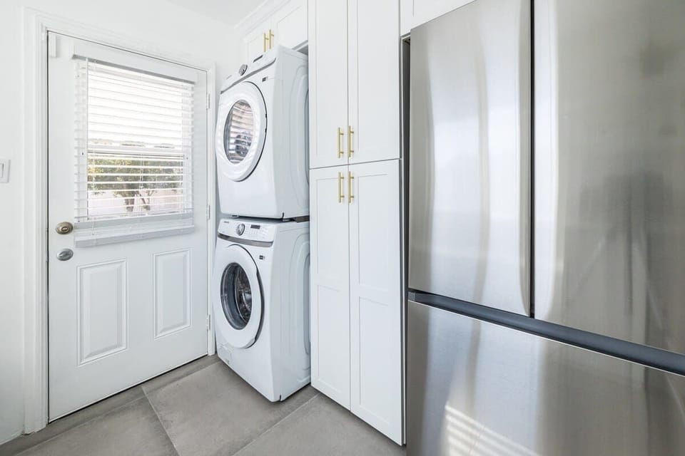 Laundry Area: Convenient laundry space equipped with a washer and dryer, allowing you to keep your clothes fresh and clean throughout your stay.