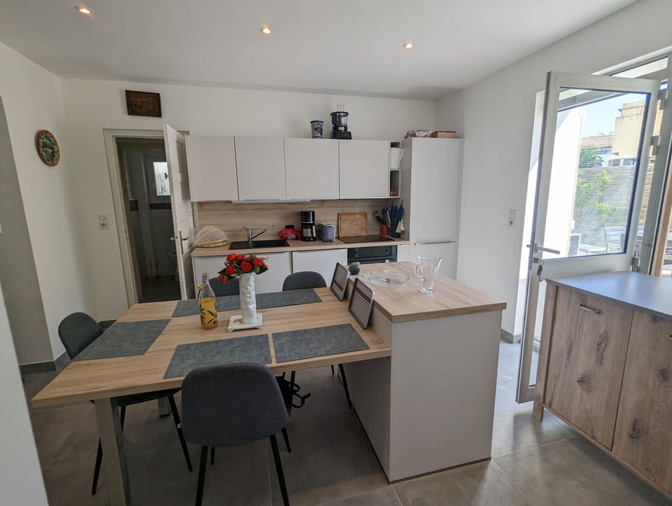 Spacious and bright kitchen and dining area, offering a pleasant setting 