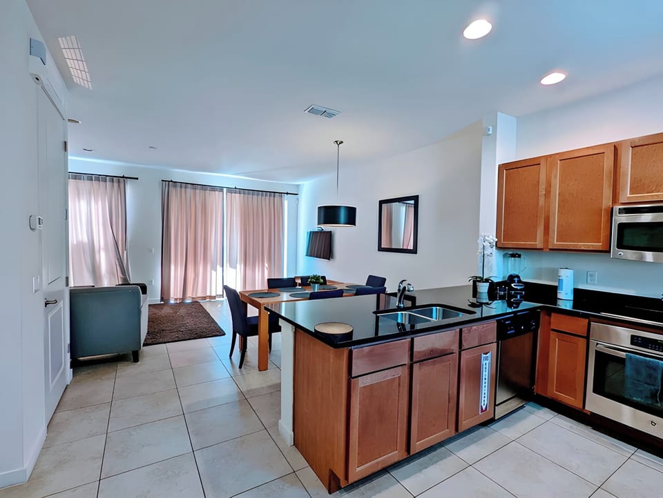 The open floor plan integrates the kitchen area with the dining and living area, overseeing your lanai with spa.There is plenty of room for family gatherings and entertainment!