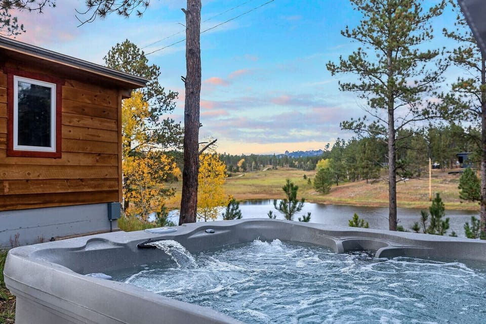 Immerse yourself in the warmth of our bubbling hot tub, surrounded by the beauty of the Black Hills