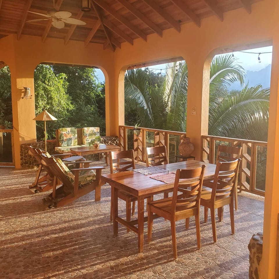 Enjoy the amazing outdoor deck with a view of mountains, stars, and lush jungle