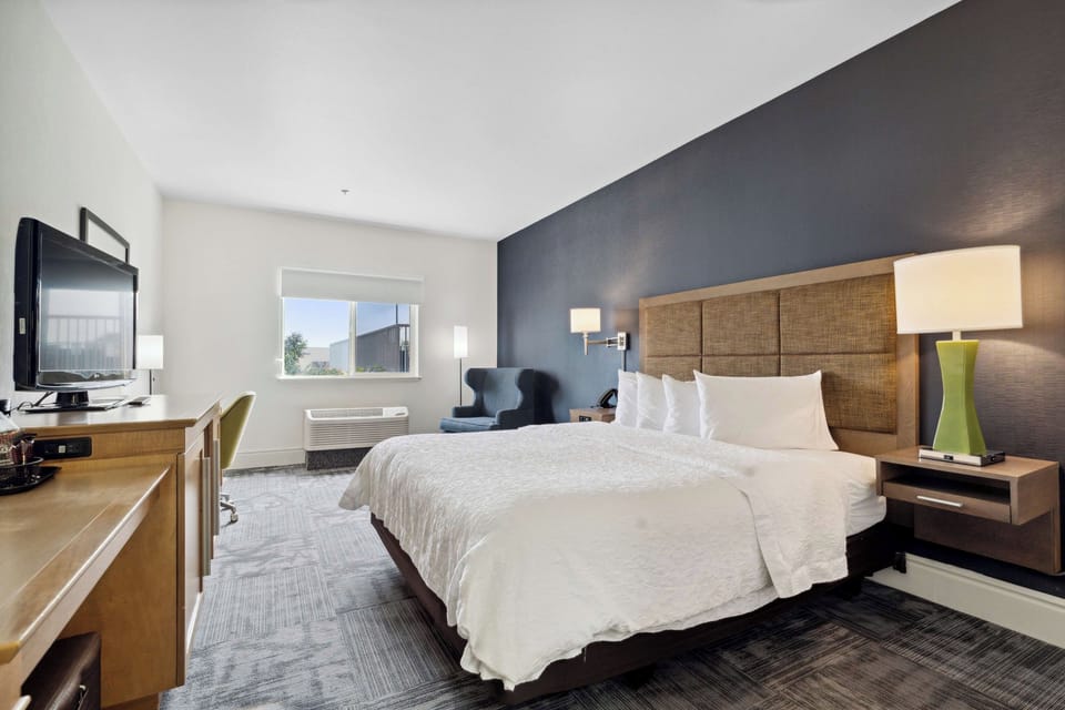 Unit with 1 King bed. Exact unit will be assigned upon arrival. Views, colors, and decor may vary.