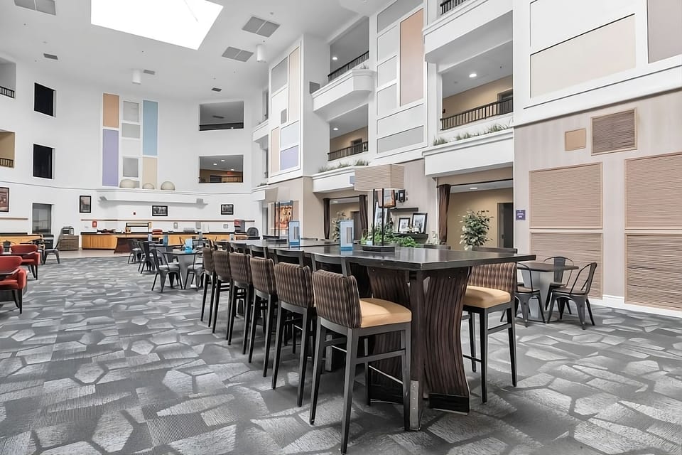 Settle in with spacious lobby seating under soaring ceilings.