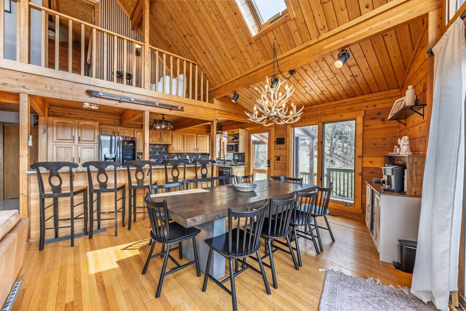 Open-concept dining and kitchen space designed for unforgettable group gatherings