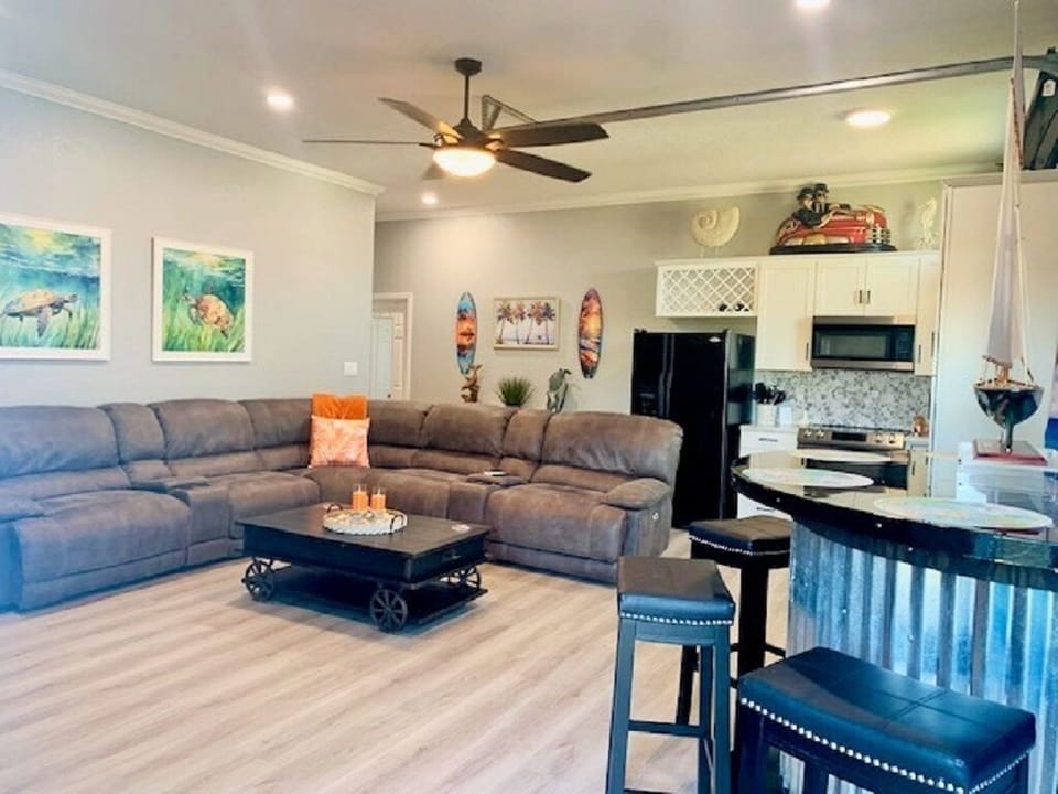 View of combo Living / Kitchen / Dining area from door entryway.