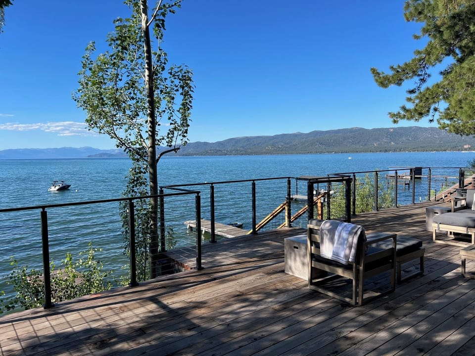 Large Deck with BBQ, stairs to dock and area to sunbathe by the water!