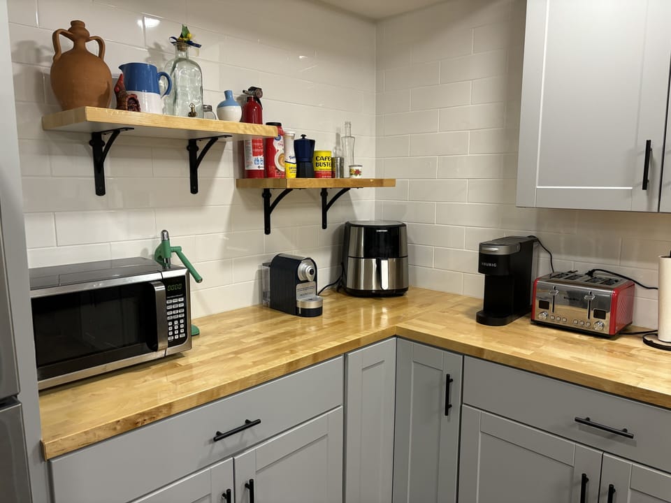 Kitchen full of gadgets including air fryer
