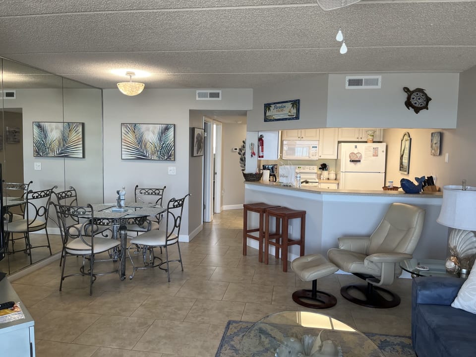 Open floor plan with living, dining and kitchen areas. 