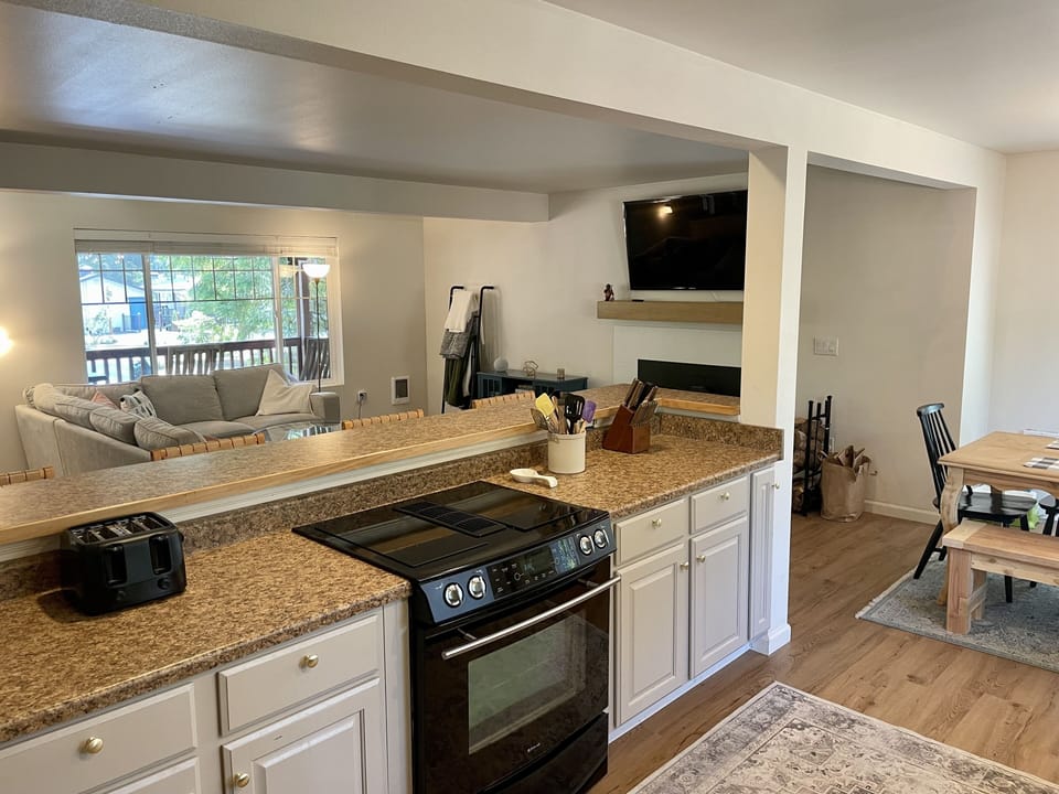 Kitchen with bar and bar stools