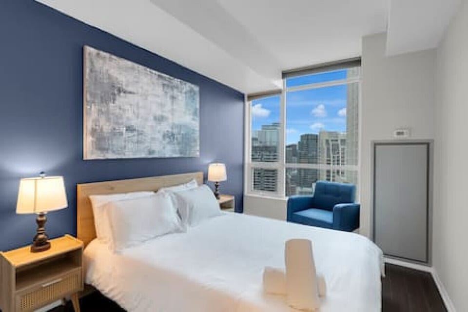 Main bedroom is comfortably adorned with a queen-size bed.