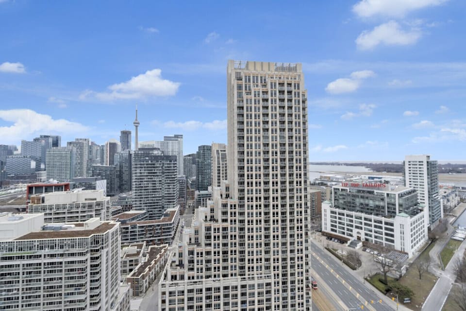 Enjoy the view of the CN Tower, the local airport, and lake.